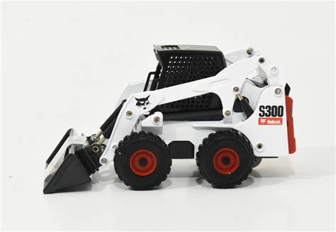 toy skid steer with attachments|bobcat skid steer toys.